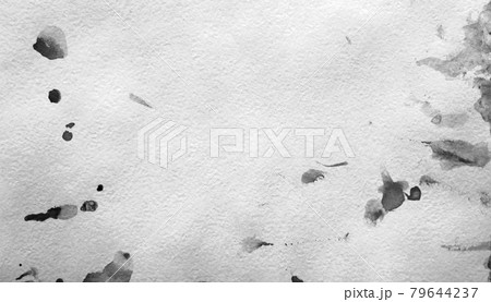 Abstract black watercolor splashes on white paper texture as background design. In black and white toned Abstract black watercolor splashes on white paper texture as background design. In black and white toned 79644237