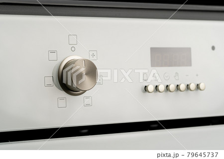 Modern oven mode control button close up 79645737
