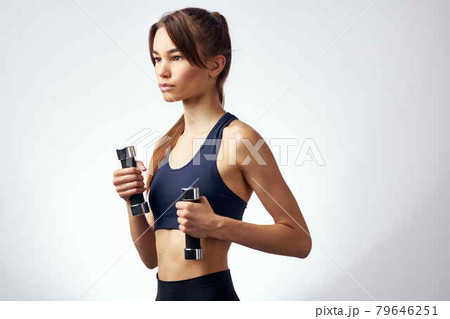 sportive woman with dumbbells in hands exercise strength motivation sportive woman with dumbbells in hands exercise strength motivation 79646251