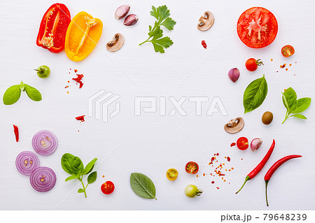 The ingredients for homemade pizza on white wooden background. The ingredients for homemade pizza on white wooden background. 79648239