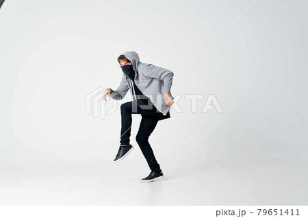 man thief hides his face crime hacker gangster 79651411
