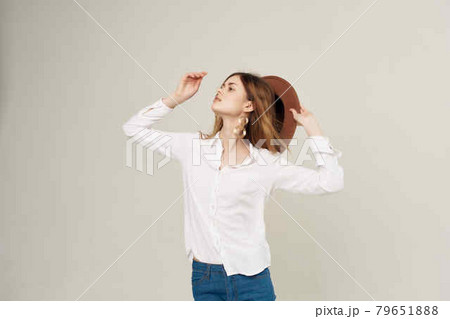 attractive woman in white shirt wearing hat decoration fashion modern style 79651888