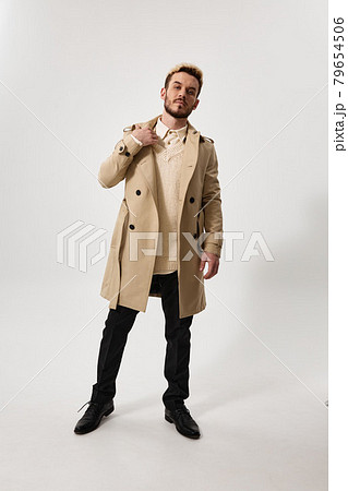 Gentleman in coat and light sweater pants shoes model 79654506