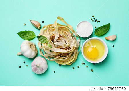 Concept of cooking tasty pasta on mint background 79655789