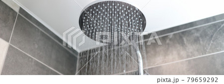 In bathroom, water flows from shower tap In bathroom, water flows from shower tap 79659292