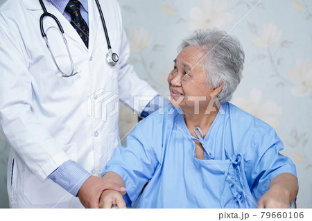 Doctor help Asian senior or elderly old lady woman patient walk with walker at nursing hospital ward. Doctor help Asian senior or elderly old lady woman patient walk with walker at nursing hospital ward. 79660106