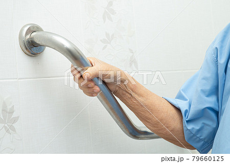 Asian senior or elderly old lady woman patient use toilet bathroom handle security in nursing hospital ward, healthy strong medical concept. 79660125