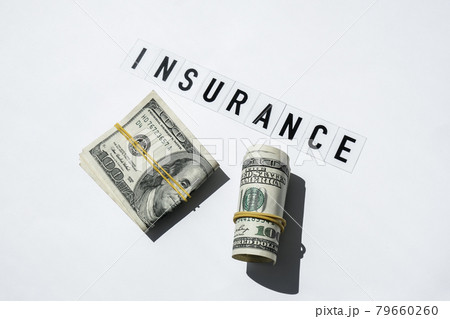 Text INSURANCE around US dollar banknotes. Health, life, home, car Insurance. Insurance business concept. Health care or medicare insurance and vaccination costs. Financial crisis. Covid-19 crimes Text INSURANCE around US dollar banknotes. Health, life, home, car Insurance. Insurance business concept. Health care or medicare insurance and vaccination costs. Financial crisis. Covid-19 crimes 79660260