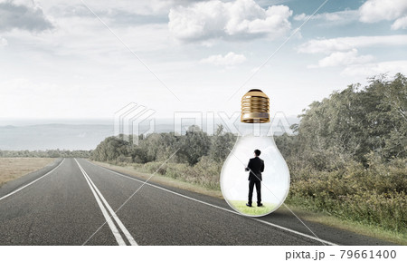 Businessman inside light bulb 79661400