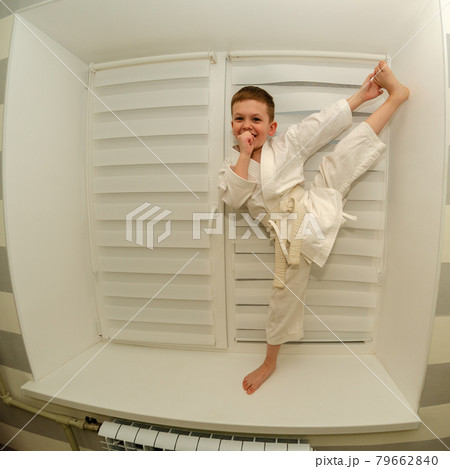Little boy of preschool age does morning exercises on a home horizontal bar 79662840