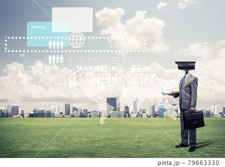 Camera headed man standing on green grass against modern citysca Camera headed man standing on green grass against modern citysca 79663330