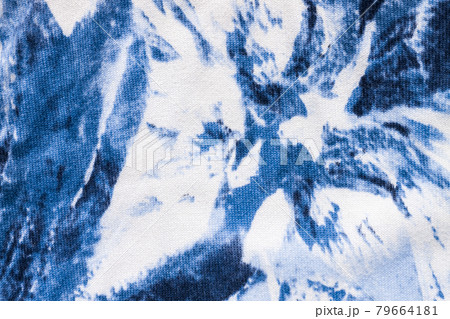 Tie-dye cotton fabric texture blue and white paint colors. Ancient resist-dyeing textile coloring technique,trendy cloth Tie-dye cotton fabric texture blue and white paint colors. Ancient resist-dyeing textile coloring technique,trendy cloth 79664181