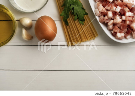 Cooking ingredients for italian carbonara on rustic surface. 79665045