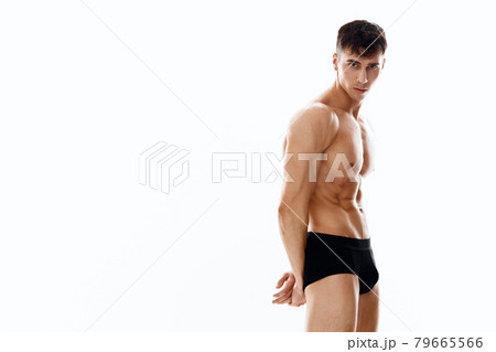 nude male athlete posing on a light background cropped view of black nude male athlete posing on a light background cropped view of black 79665566