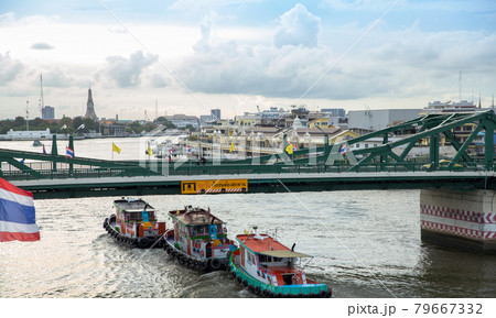 Cargo ships passing under the bridge at Chao Phraya River and river side view Cargo ships passing under the bridge at Chao Phraya River and river side view 79667332