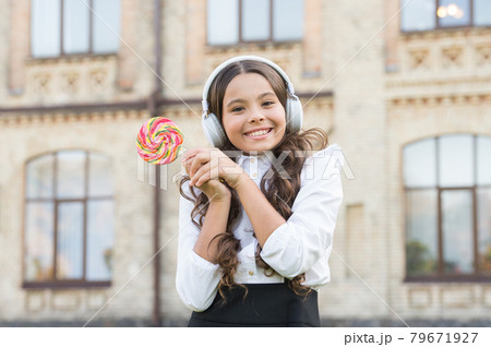 sweet makes her happy. modern look of schoolgirl. kid sweet makes her happy. modern look of schoolgirl. kid 79671927