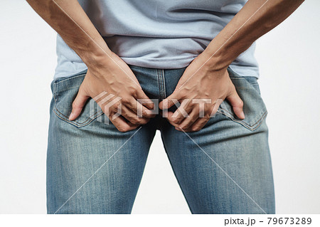 Young Man holding his bottom because Diarrhea, Hemorrhoids, constipation. Health care and medical concept. 79673289