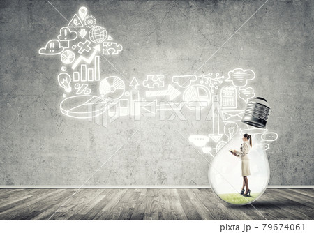 Businesswoman trapped in bulb 79674061
