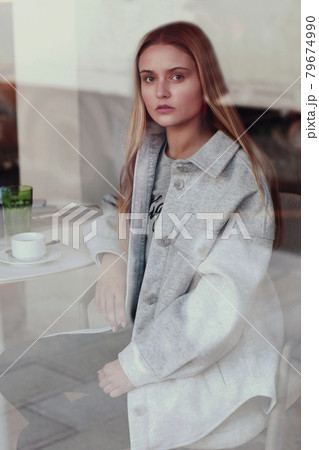 blond long hair beautiful girl with cup of coffee close up portrait blond long hair beautiful girl with cup of coffee close up portrait 79674990