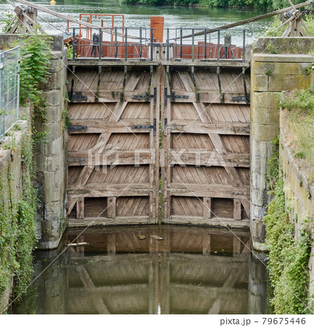 Historical lock with a wooden lock gate 79675446