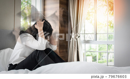 Vertigo illness with dizziness in woman patient on bed in bedroom at home feeling dizzy, faint with spinning movement inside head from benign paroxysmal positional vertigo (BPPV), migraine headaches Vertigo illness with dizziness in woman patient on bed in bedroom at home feeling dizzy, faint with spinning movement inside head from benign paroxysmal positional vertigo (BPPV), migraine headaches 79676603