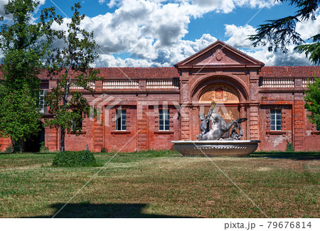 Venaria Reale,Piedmont,Italy. The summer royal residence of the Savoy family: the castle of the herd. In the inner courtyard there is a fountain with mythological creatures a horse and a man half fish Venaria Reale,Piedmont,Italy. The summer royal residence of the Savoy family: the castle of the herd. In the inner courtyard there is a fountain with mythological creatures a horse and a man half fish 79676814