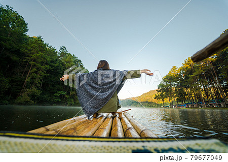 solo asian woman travel by thai local bamboo boat in tropical forest and lake in autumn season solo asian woman travel by thai local bamboo boat in tropical forest and lake in autumn season 79677049