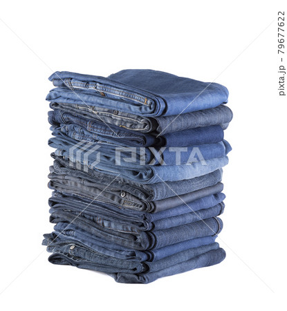 Stack of blue jeans isolated on white background with clipping path 79677622