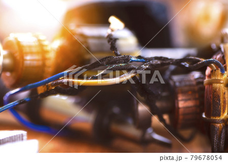 Power tool repair. Details of electrical appliance and repair tools on a wooden table in a repair shop 79678054