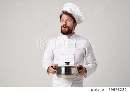 cheerful chef with a saucepan in his hands kitchen cooking work 79678225
