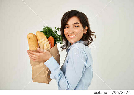 brunette with a package of health products shopping in the supermarket brunette with a package of health products shopping in the supermarket 79678226