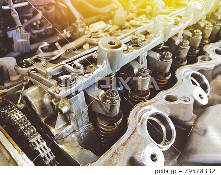 Adjusting nuts and valve spring of the car engine valve is open for adjustment level Adjusting nuts and valve spring of the car engine valve is open for adjustment level 79678332
