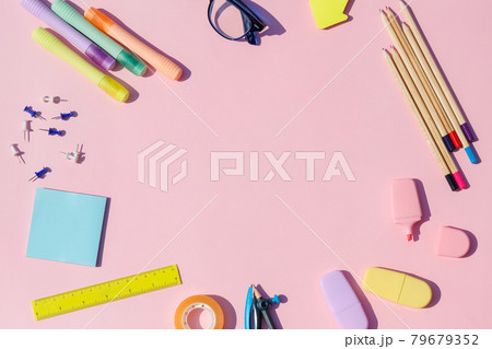 Back to school bright concept, frame with colorful school supplies with medical mask on pink background . 79679352