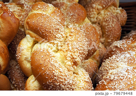 Fresh baked sweet plaited loafs. 79679448