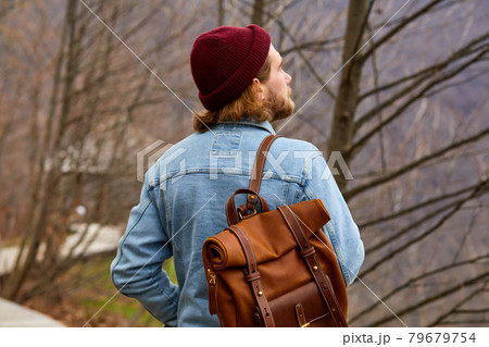 hipster traveler man enjoying natural surroundings, stand in contemplation hipster traveler man enjoying natural surroundings, stand in contemplation 79679754