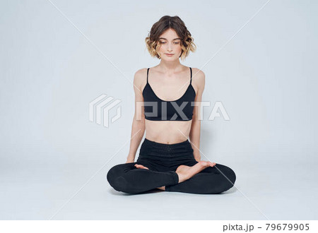 Meditation yoga woman asana light background crossed legs 79679905