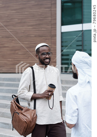 Muslim Colleagues Discussing Business Muslim Colleagues Discussing Business 79680245