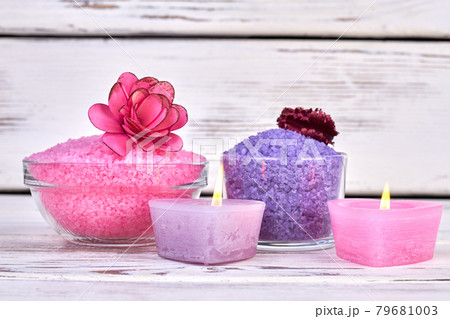 Still life colored himalayan salt and burning candles. 79681003