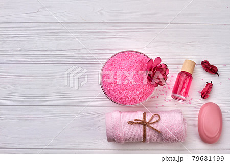 Top view pink accessories for spa on white wooden desk. Top view pink accessories for spa on white wooden desk. 79681499