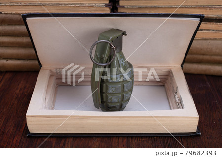 hand grenade hidden in a book hand grenade hidden in a book 79682393
