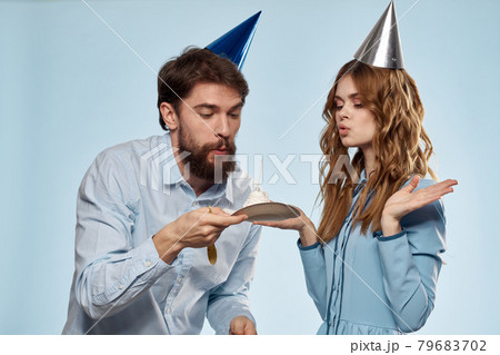 Birthday corporate young man and woman with cake on isolated background disco party 79683702