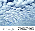 Altocumulus and Cirrocumulus, Small clouds spread across the blue sky. Skyscape background. 79687493