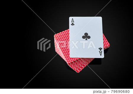 Full deck of playing cards with ace on top on dark reflective background 79690680