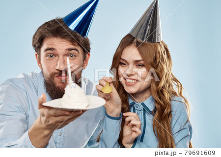 Birthday corporate young man and woman with cake on isolated background disco party 79691609