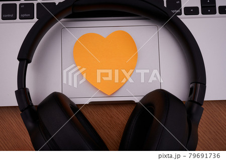 Blank Notepad Over Laptop With Pen And Headphones Beside Cup Of Warm Coffee. Empty Journal On A Notebook Computer With A Ballpen And Headset Close To Mug Of Hot Drink. Blank Notepad Over Laptop With Pen And Headphones Beside Cup Of Warm Coffee. Empty Journal On A Notebook Computer With A Ballpen And Headset Close To Mug Of Hot Drink. 79691736