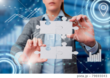 Business Woman Holding Jigsaw Puzzle Piece With Two Hands Unlocking New Futuristic Technologies. Palm Carrying Puzzles Part Displaying Solving Late Innovative Virtual Ideas. 79693043