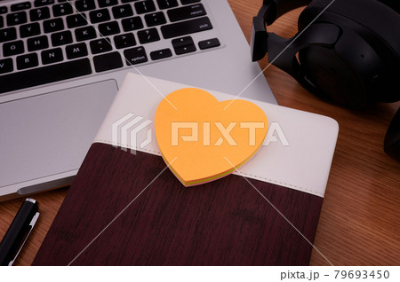 Blank Notepad Over Laptop With Pen And Headphones Beside Cup Of Warm Coffee. Empty Journal On A Notebook Computer With A Ballpen And Headset Close To Mug Of Hot Drink. 79693450