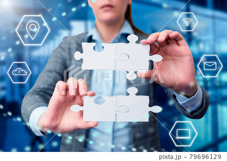 Business Woman Holding Jigsaw Puzzle Piece With Two Hands Unlocking New Futuristic Technologies. Palm Carrying Puzzles Part Displaying Solving Late Innovative Virtual Ideas. 79696129