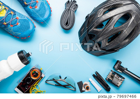 Cycling equipment is laid out in a circle. Emptiness in the middle of the circle. Place for the inscription cycling composition. Copy space. 79697466