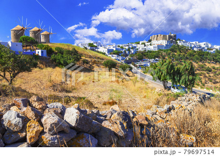 Traditional Greece - Patmos island. View of old windmills and monastrey Traditional Greece - Patmos island. View of old windmills and monastrey 79697514